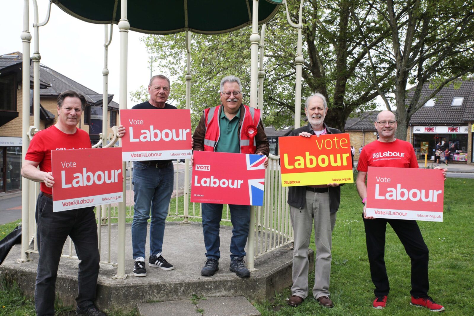 Picture of campaigners holding vote Labour signs